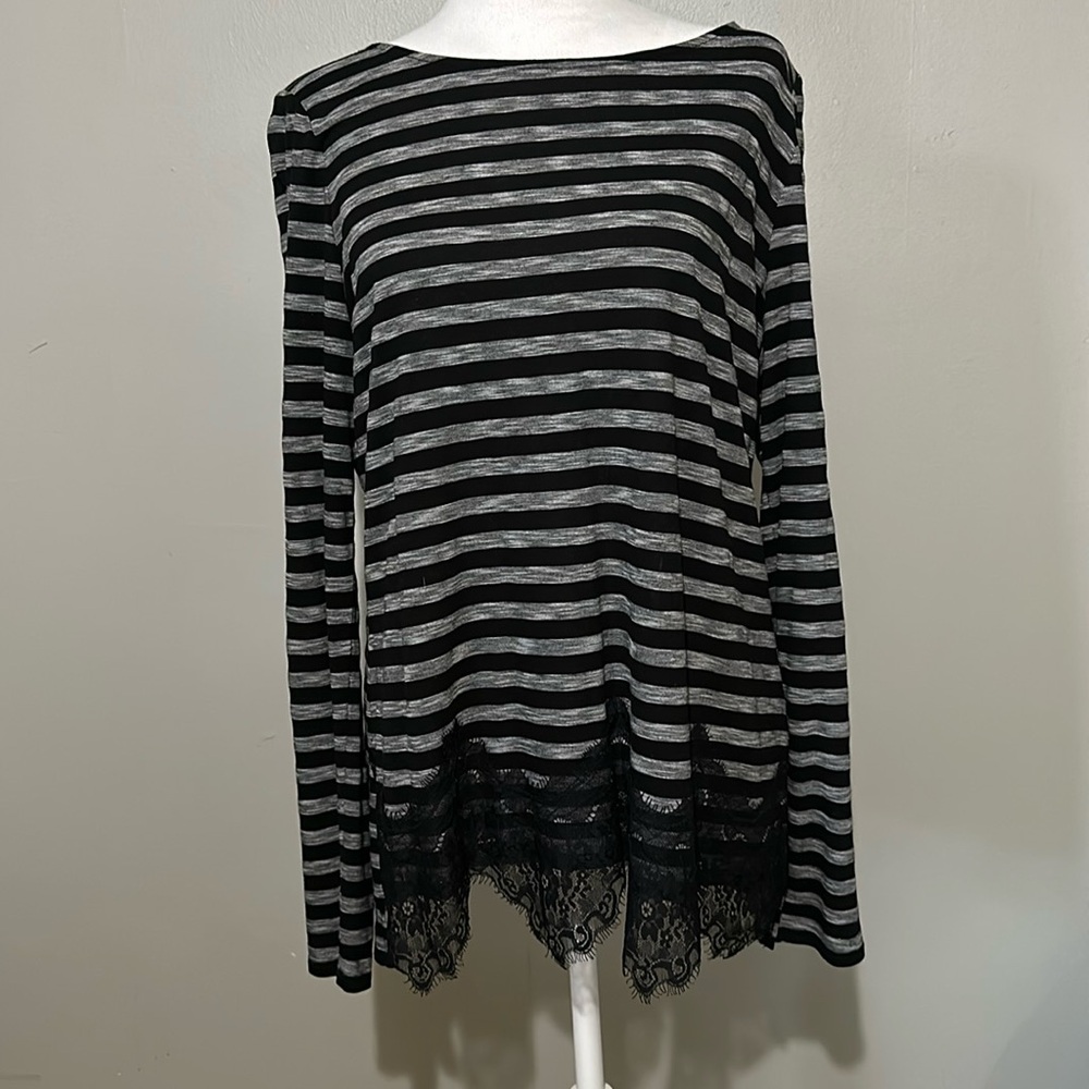 White House Black Market women’s blouse with lace detail.